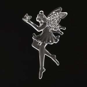 Macro view of clear fairy-shaped acrylic ornament for Christmas tree decor