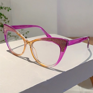 Detailed view of cat eye glasses with purple to orange gradient and glitter accents
