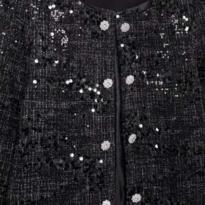 Elegante schwarze Tweedjacke mit glitzernden Pailletten und floralen Strassknöpfen