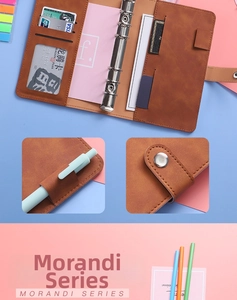 Detail view of the vintage brown A6 binder showing 6-ring clips, card slots and pen holder
