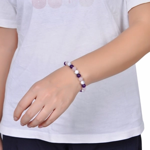 Natural Amethyst and Rose Quartz beaded bracelet with White Turquoise on a female wrist