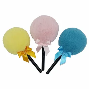 Three-piece set of colorful plush powder puffs with satin bows and black handles