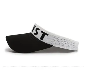 Side view of knitted sun visor hat featuring a bold ST letter print on white band