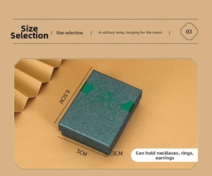 Dark green jewelry gift box measuring 8.5x5x3cm with bow pattern for necklaces and rings