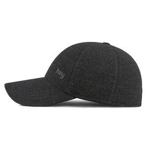Winter thermal baseball cap with ear protection and warm fleece lining in dark grey color