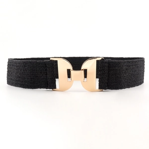 Women's elastic woven belt in black with a geometric gold metal buckle on white background