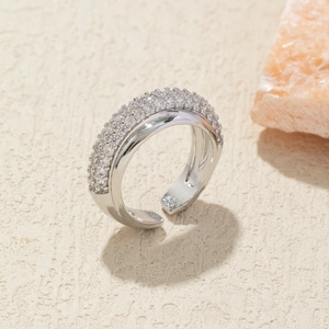 Macro detail of silver double-layer open ring with micro-pave cubic zirconia crystals