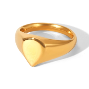 Detailed macro view of gold plated teardrop signet ring with high polished finish