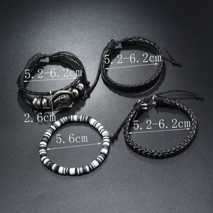 Detailed view of 4-piece men's leather bracelets set with eagle charm and braided texture