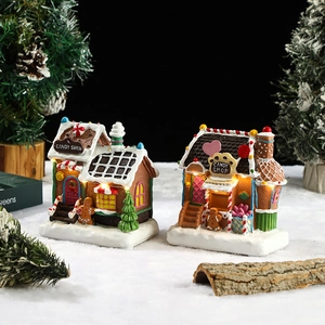 Lighted resin gingerbread candy house Christmas ornaments with warm LED glow and snow