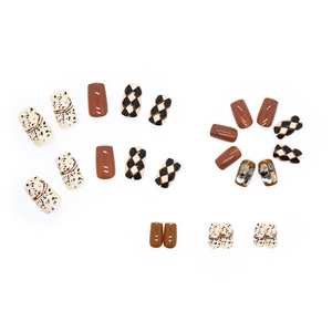 Brown press-on nails with retro checkered pattern, sparkling diamonds and autumn style
