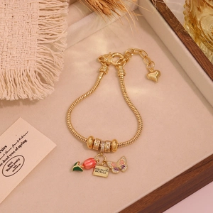 18K gold tulip and butterfly charm bracelet with a To My Beautiful Mother pendant