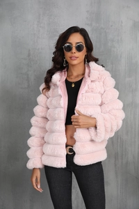 Detail showing plush pink faux fur texture and soft long-pile material on women's winter jacket