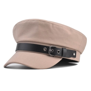 Detail view of khaki baker boy hat with black leather strap and metal buckle
