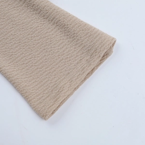 Detail of khaki waffle fabric texture and durable double-stitched sleeve edge