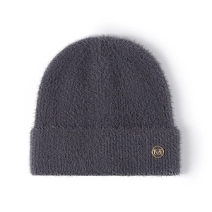 Dark grey fluffy knit beanie with a golden metal letter M logo on the folded cuff
