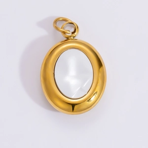 Detail view of oval 18k gold plated stainless steel pendant with white shell inlay