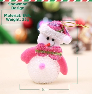 Detail of pink and white EVA snowman ornament with gold string for Christmas tree