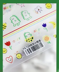 Close-up of matte cartoon dinosaur and flower nail stickers showing ultra-thin texture