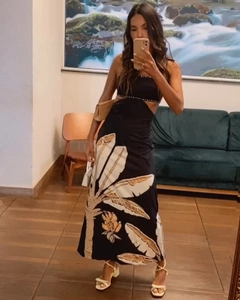 Detail of tropical palm leaf print maxi dress with waist cut-out and beaded edge