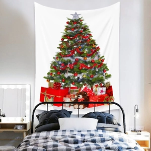 Detail of Christmas tree tapestry with festive gifts and teddy bear in a cozy bedroom