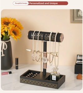 Detail view of T-bar jewelry display stand with golden arrows for bracelets and watches