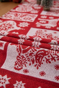 Dettaglio della trama jacquard con motivi natalizi di renne e fiocchi di neve