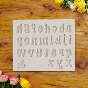 Silicone mold featuring lowercase a-z letters and ampersand for DIY fondant and baking