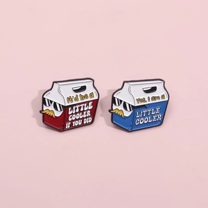 Set of two cartoon cooler enamel pins in red and blue with fun typography on pink background