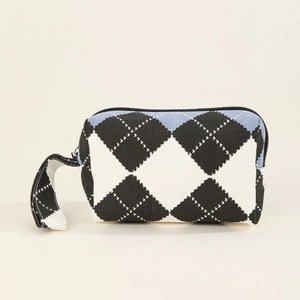 Canvas checkered print makeup bag with black white and blue diamond pattern and handle