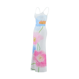 Close-up of a white floral maxi dress with slim straps and vibrant pink flower print