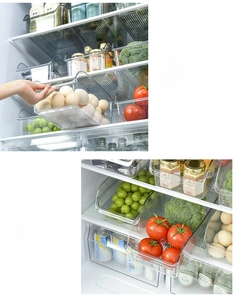 Detailed view of high-transparency food storage boxes organizing eggs and fresh produce