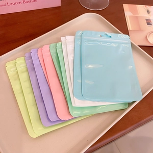 Macro shot of colorful resealable storage bags with zip lock and hanging hole detail