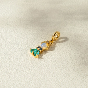 Golden mermaid tail pendant with white opal and blue-green zircon inlay for necklaces