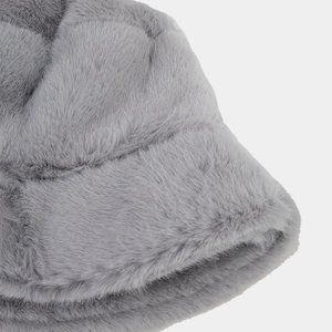 Close-up of the plush grey faux fur texture and stitching on the winter bucket hat