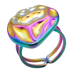 Macro shot of iridescent rainbow finish ring with textured irregular shape top and open band