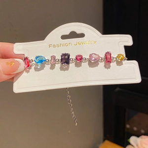 Macro shot of French luxury multicolor crystal bracelet with adjustable silver chain