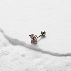 Detailed view of silver butterfly stud earring with pink and white zirconia stones
