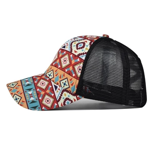 Side view of multi-color geometric print ponytail hat with black breathable mesh back