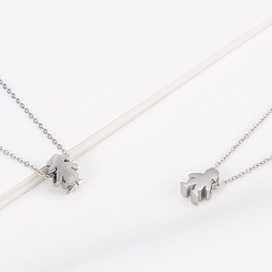 Polished stainless steel boy and girl silhouette charms on fine link chain necklaces