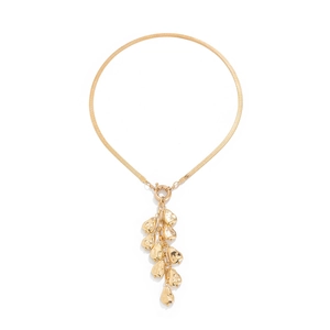 Detail of golden herringbone snake chain necklace with hammered metal pendant fringe