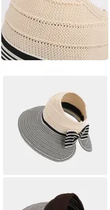 Detail of straw woven sun visor with striped brim and elegant bow decoration