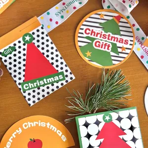 Christmas gift cards with festive trees and patterns on a wooden background