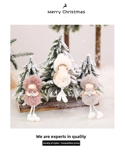 Close-up of cute Christmas angel plush ornaments in pink, white, and grey with soft legs