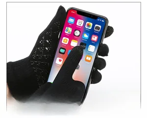 Close-up of black tactical fleece gloves featuring touch screen fingertips and anti-slip grip