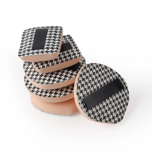 Houndstooth pattern makeup puff set for wet and dry foundation application on white background