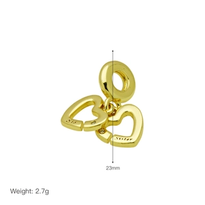 Detailed view of gold interlocking heart charms engraved with Sis and Sister text