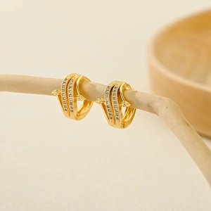 Fashionable gold plated hoop earrings with double row cubic zirconia and arrow motifs