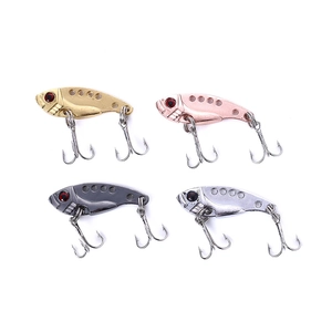 Detailed view of four colorful mini metal lures with red eyes and sharp treble hooks