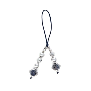 Silver beaded keychain with metal dice charms for bags and phones on white background